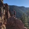 Beau Evans with camera on cliff