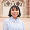 A portrait of Bianca in front of the library.