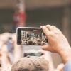 Person taking a picture of a performer.