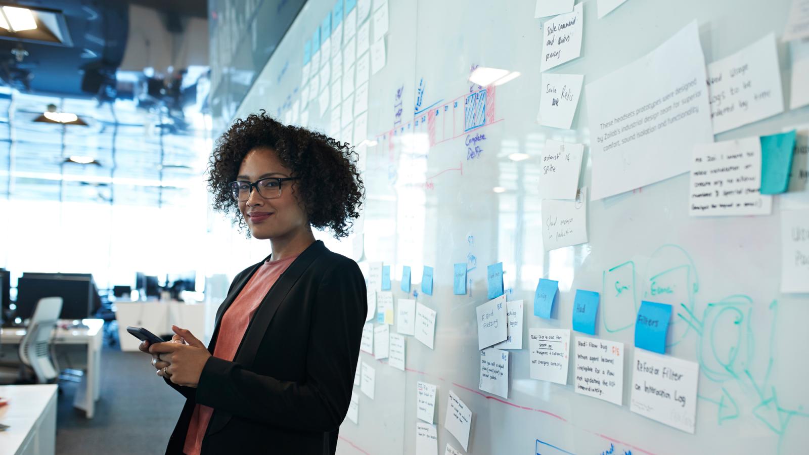 Woman in front of whiteboard