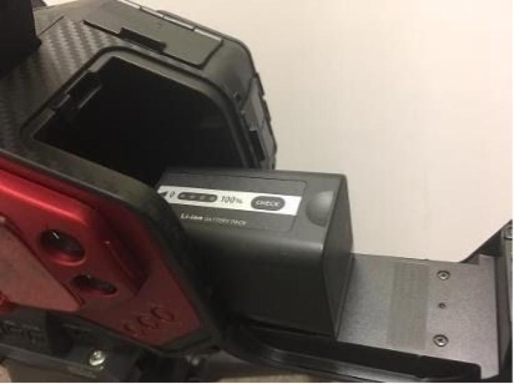 Opening compartment and sliding battery in