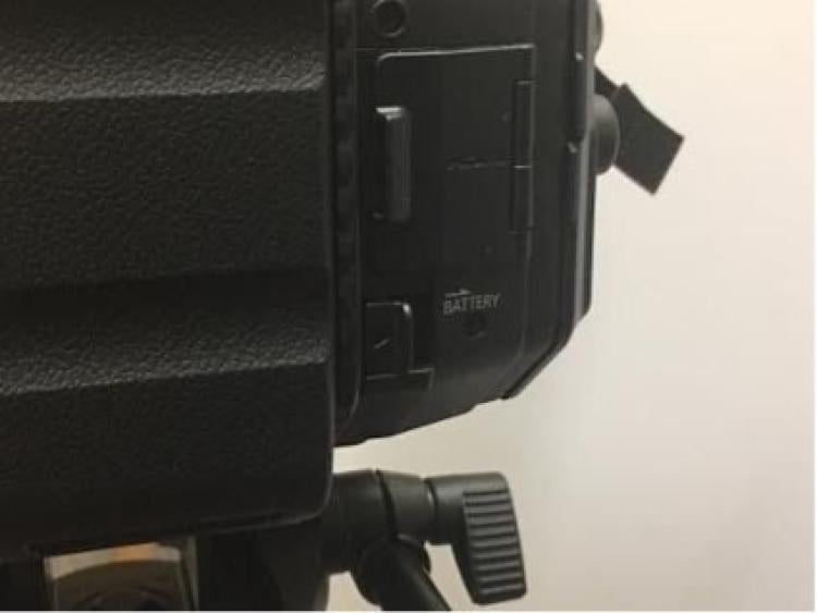 Battery remove latch on side of battery compartment