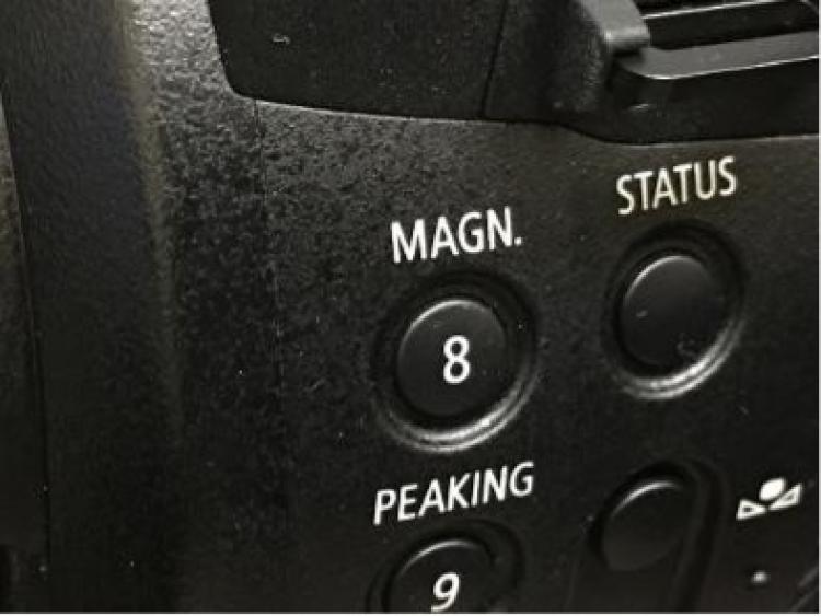 MAGN. Button