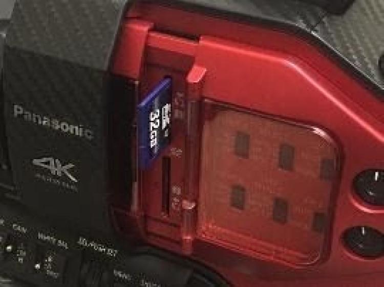 SD card partially inserted into camera