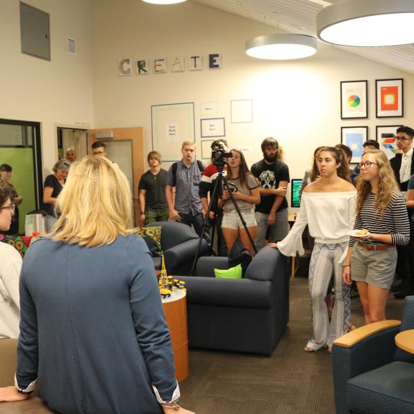 The audience listens to Jen Kellerman's speech