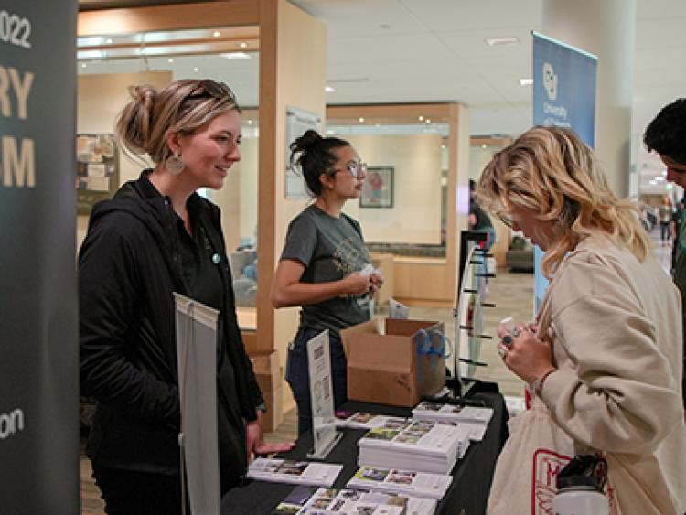 CMCI staff answer questions of advisors and students at J-Day.
