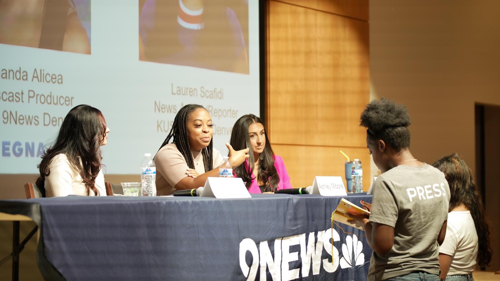A group of 9News journalists answers questions from student reporters.