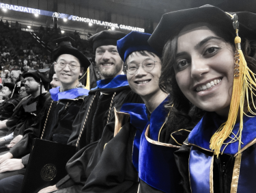A picture of graduating PhD students.