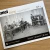 A copy of the fall 2022 CMCI Now magazine resting on a wooden desktop.