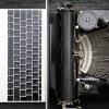 A modern laptop and an old-fashioned typewriter side by side on a wooden desktop.