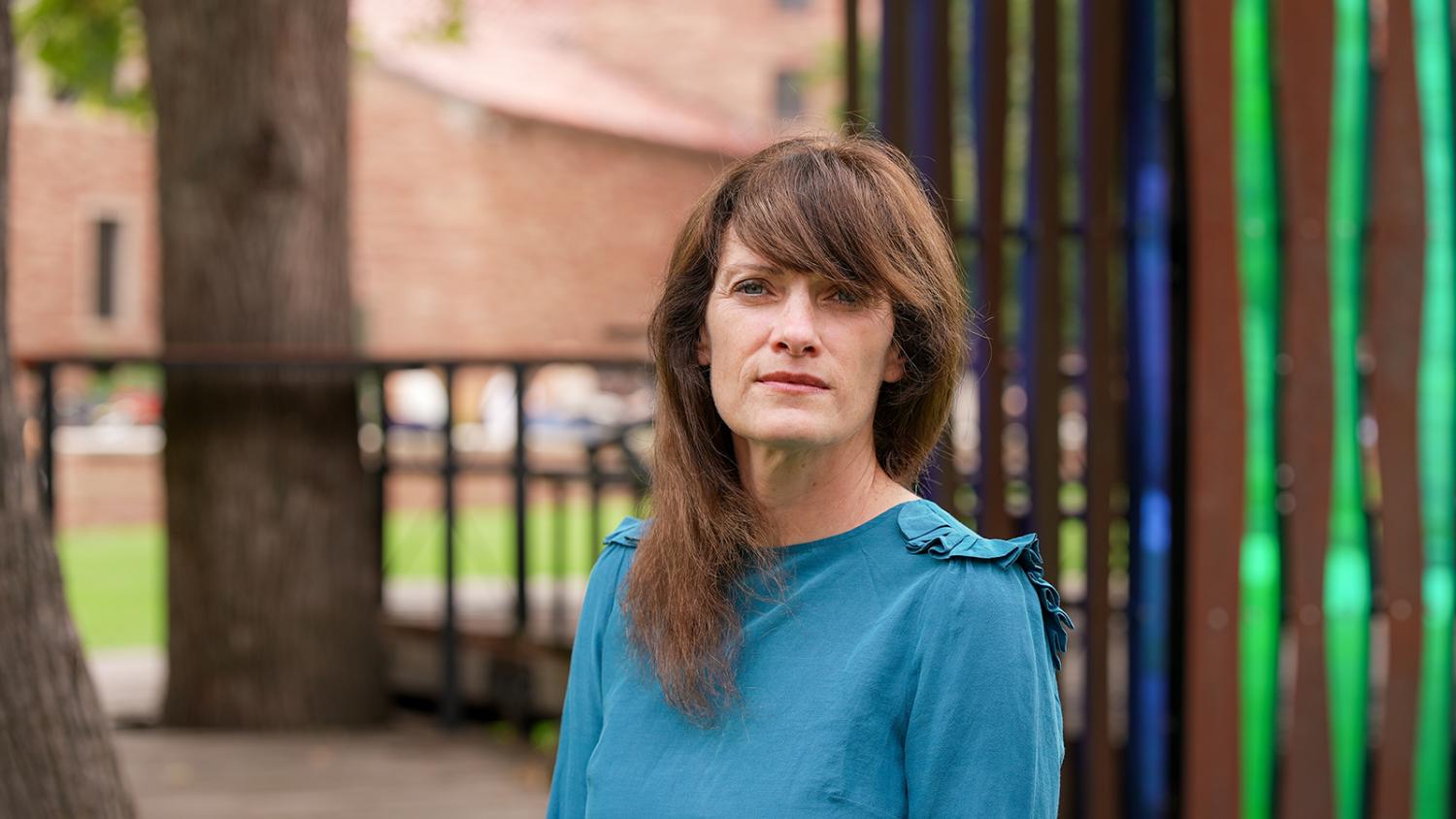Caitlin Charlet poses outside the treehouse office on the CU Boulder campus.