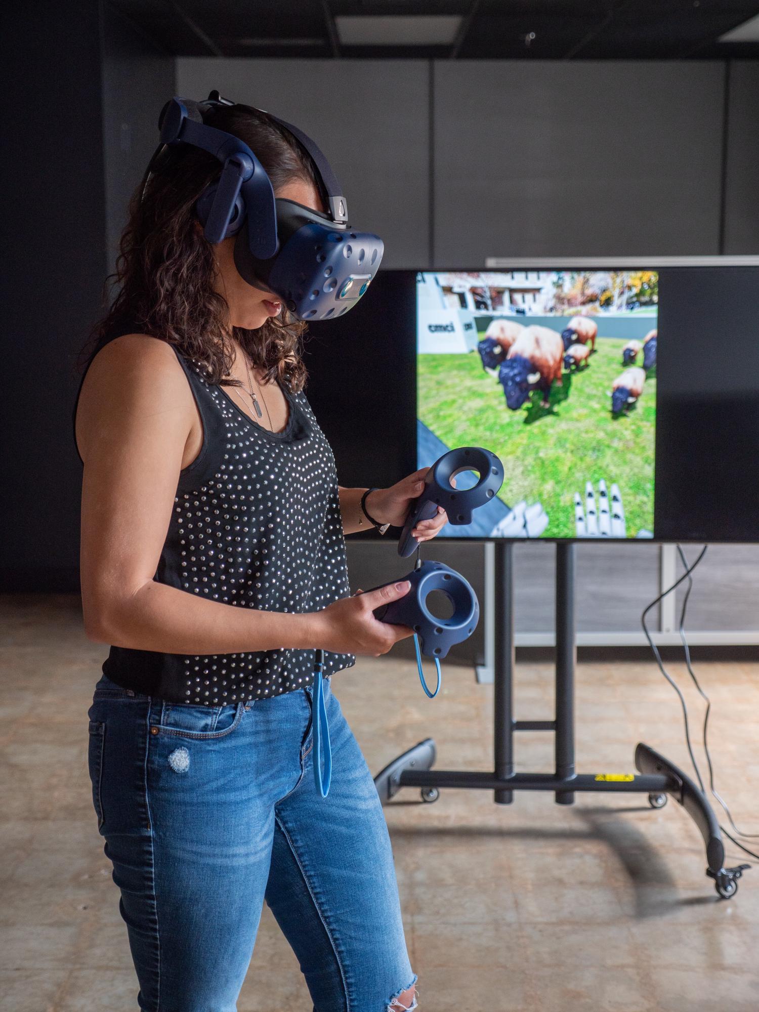 Alum Erin Baptiste poses in what became the Immersive Media Lab