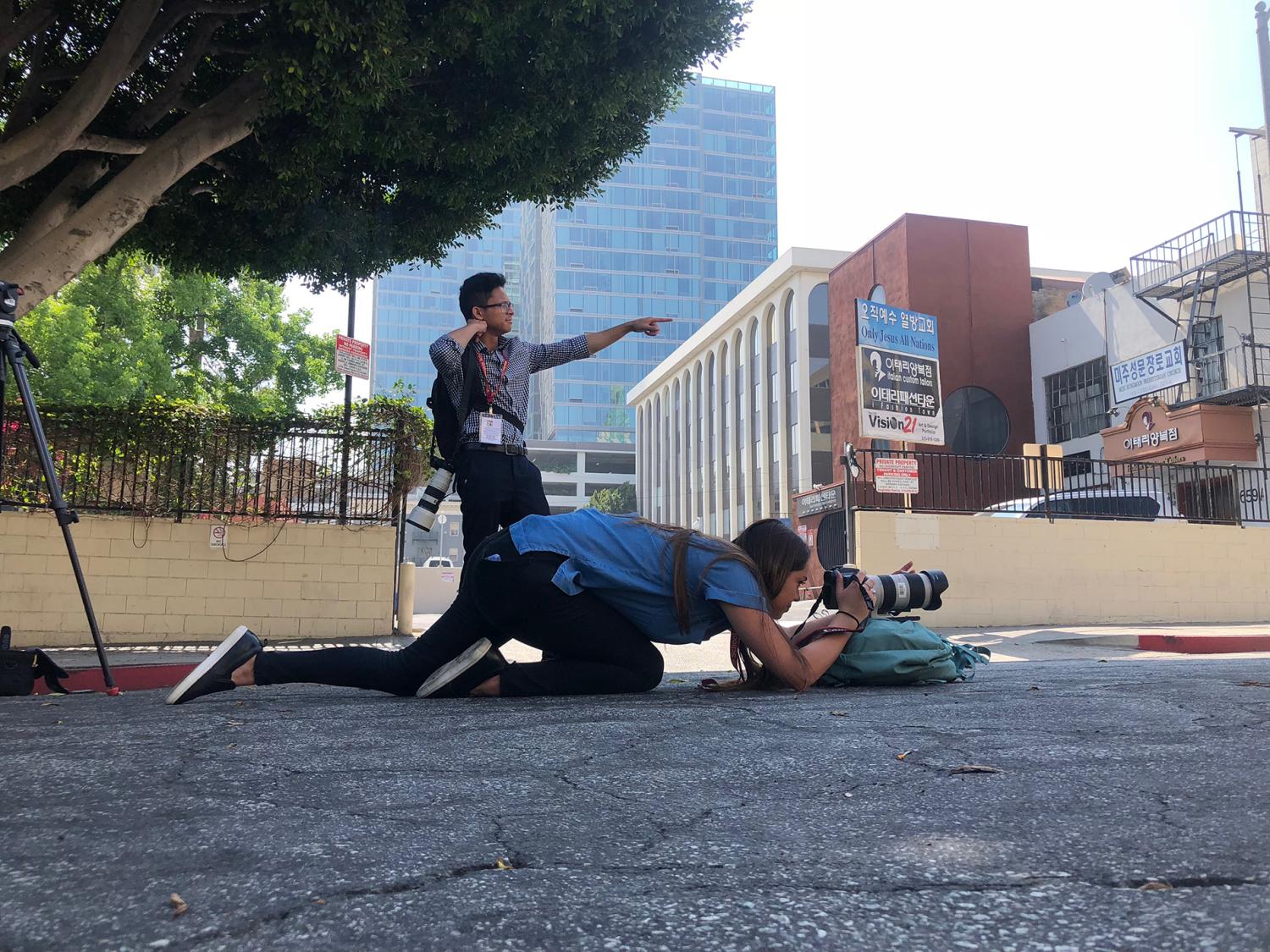 News21 fellows Angel Mendoza and Tessa Diestel prepare their shot while filming in Los Angeles, California. Photo by News21 fellow Brendan Campbell.
