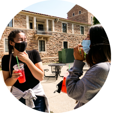 Students laugh and bond during the tour of CU Boulder campus.