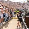 Students and photographer at CU v USC game on Folsom Field