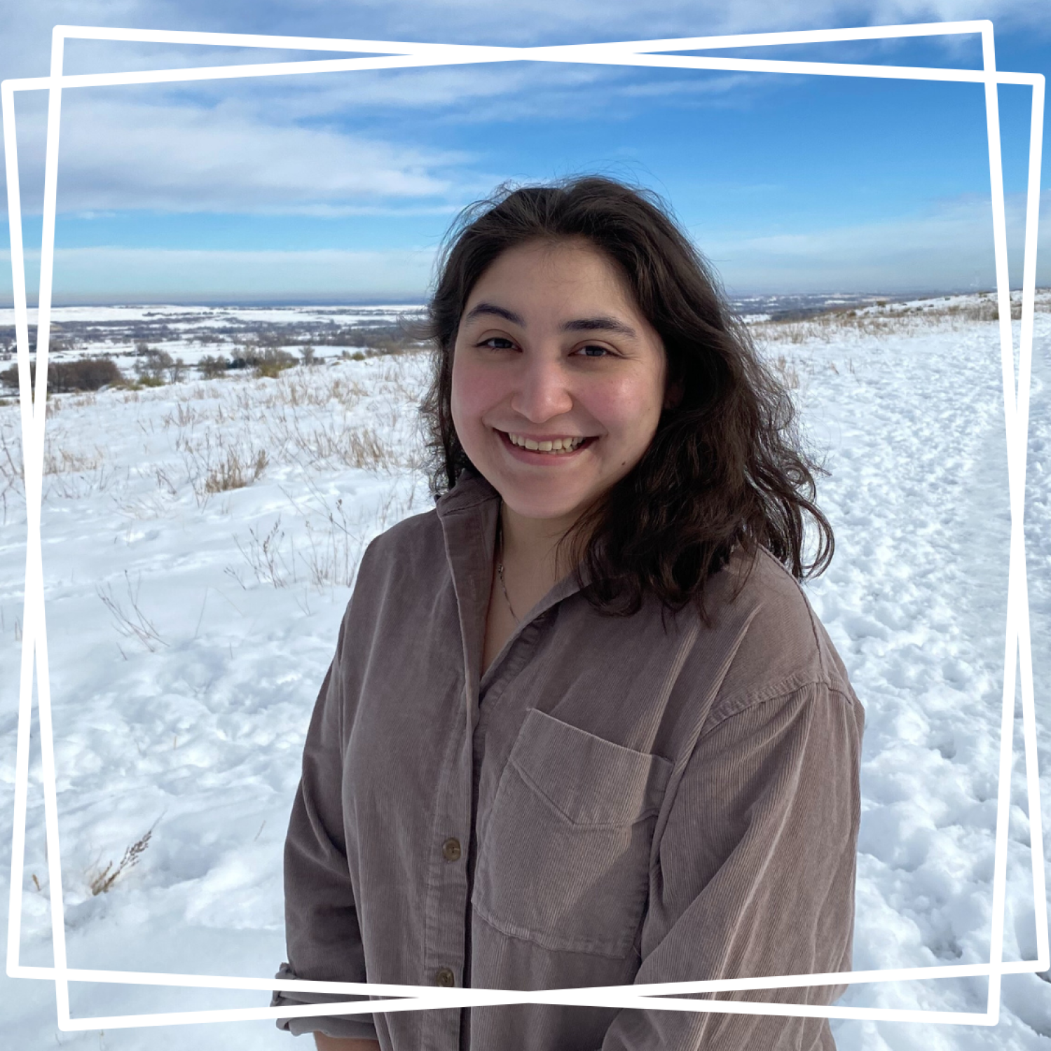 Lila standing in front of snowy landscape