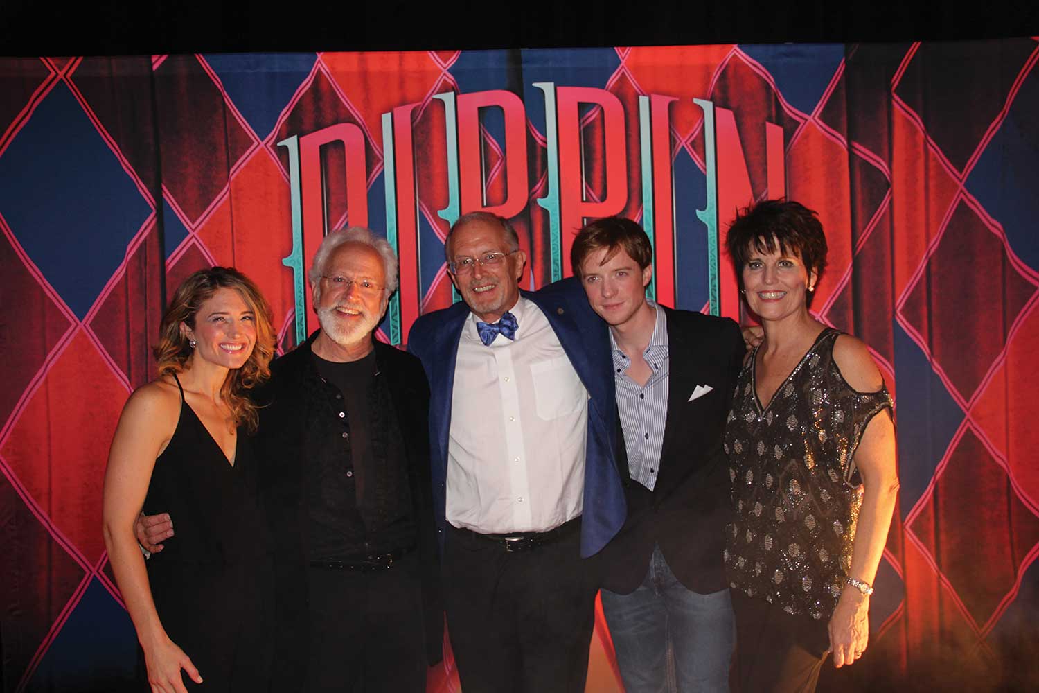 Randy Weeks (center) of the Denver Center for the Performing Arts with the cast of “Pippin”