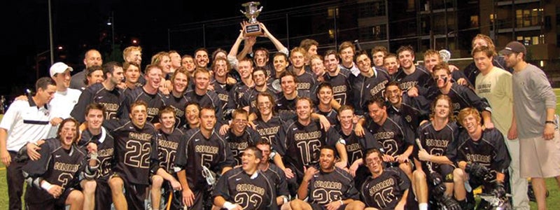 club sports team posing with trophy