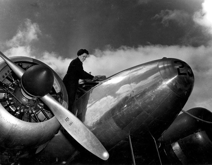 woman on airplane black and white