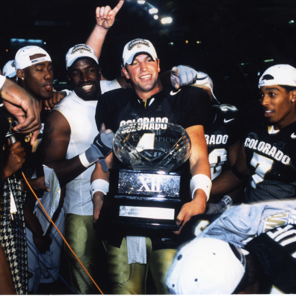 Bobby Pesavento holds the 2001 Big 12 Championship Trophy