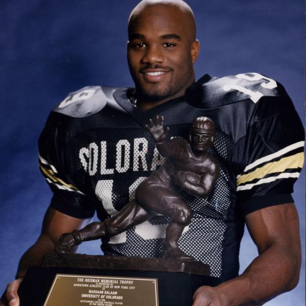 Rashaan Salaam holding the Heisman trophy
