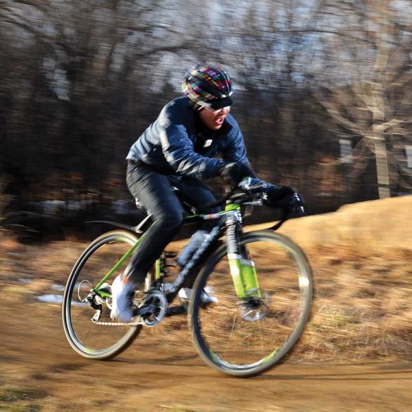 Allen Lim riding his bike on a trail