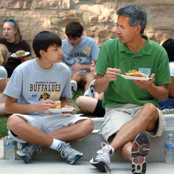 parent and student outside dorm