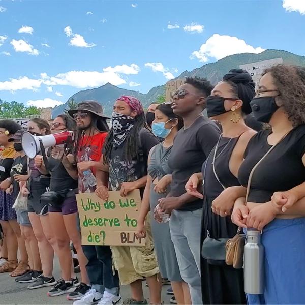 a line of protesters at a Black Lives Matter protest