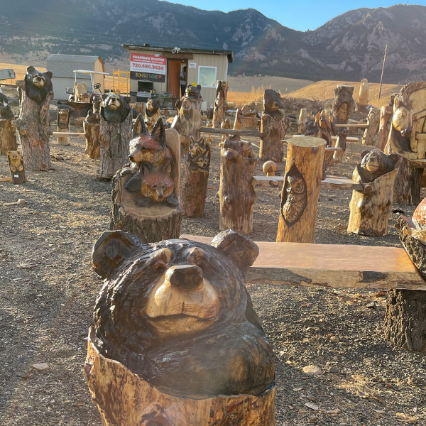 Bongo Love's wood carvings outside of the Rocky Flats Bar & Grill.