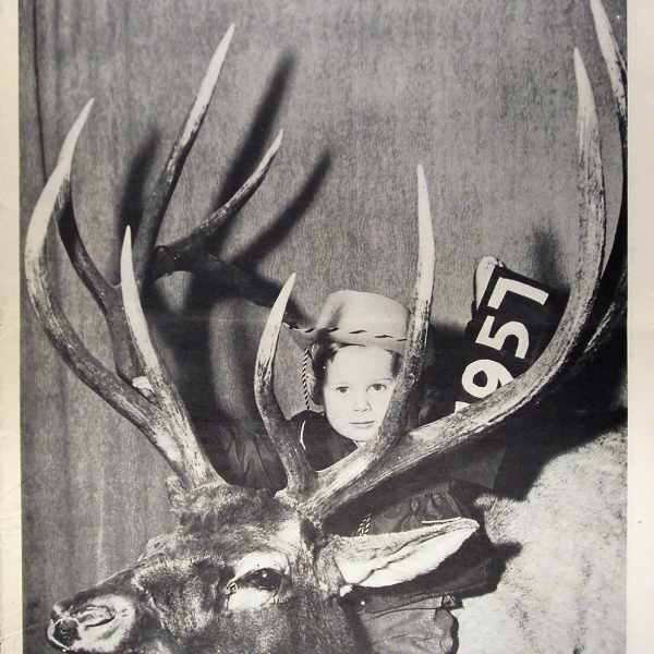 "The Cody Enterprise" magazine cover from 1954 showing a young boy with a deer carcass