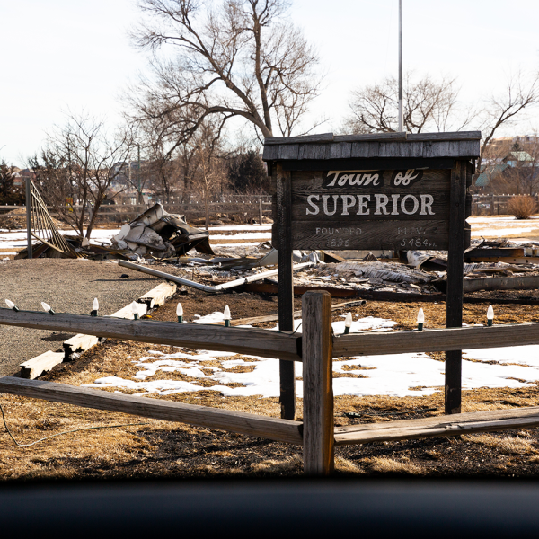 Town of Superior sign surrounded by environment impacted by the Marshall Fire