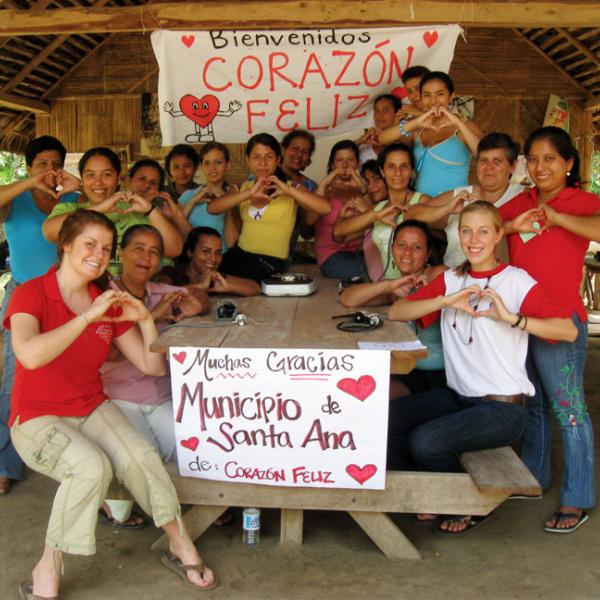 CU peace corps group photo with children