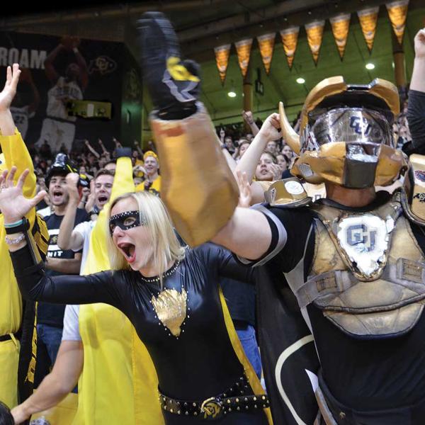 ick Shearon, known as “Buff Man,” and “Buff Girl” Courtney Benejam cheer on the Buffs