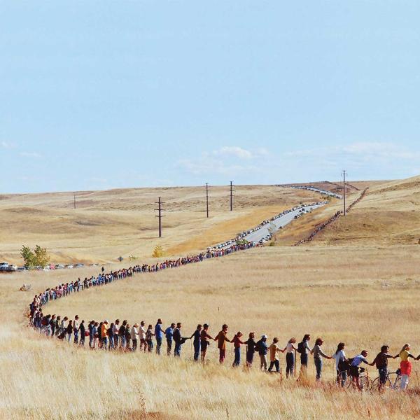 An estimated 17,000 people joined hands to encircle the plant’s 17-mile perimeter