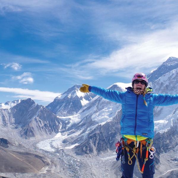 Kimberly Hess on top of a mountain
