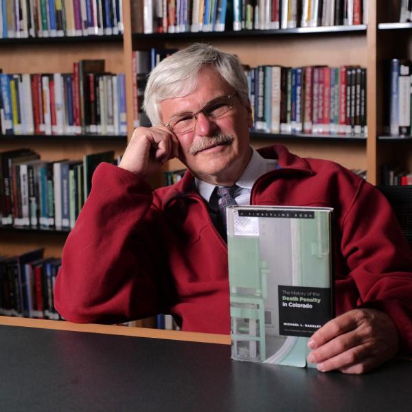 michael radelet posing with his book