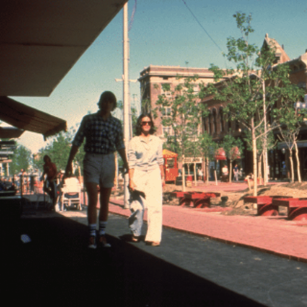 Couple walking new pedestrian walkway on Pearl Street
