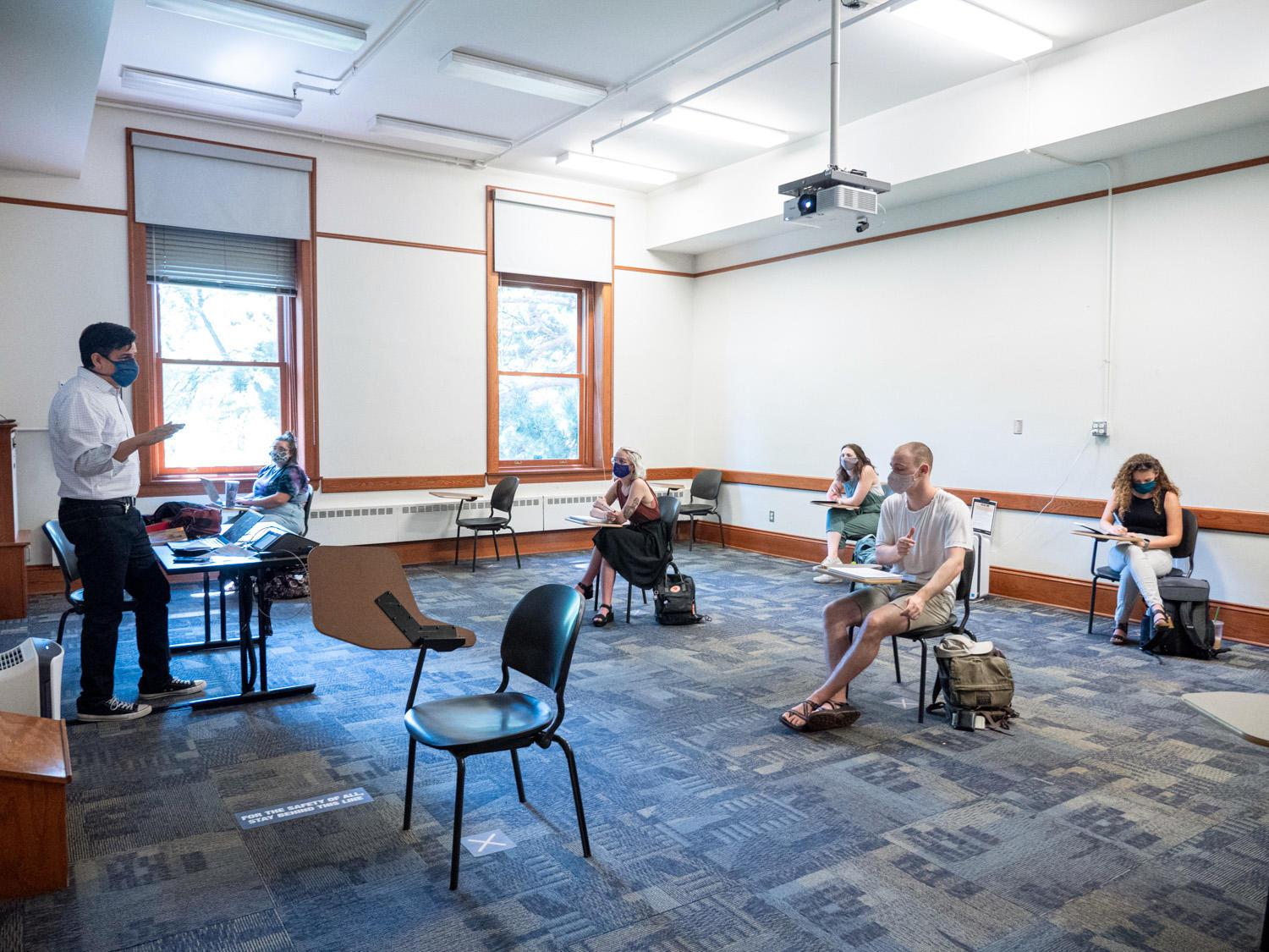 CU Boulder professor Dimitri Nakassis teaches a socially distanced class in the Hale Science Building. 