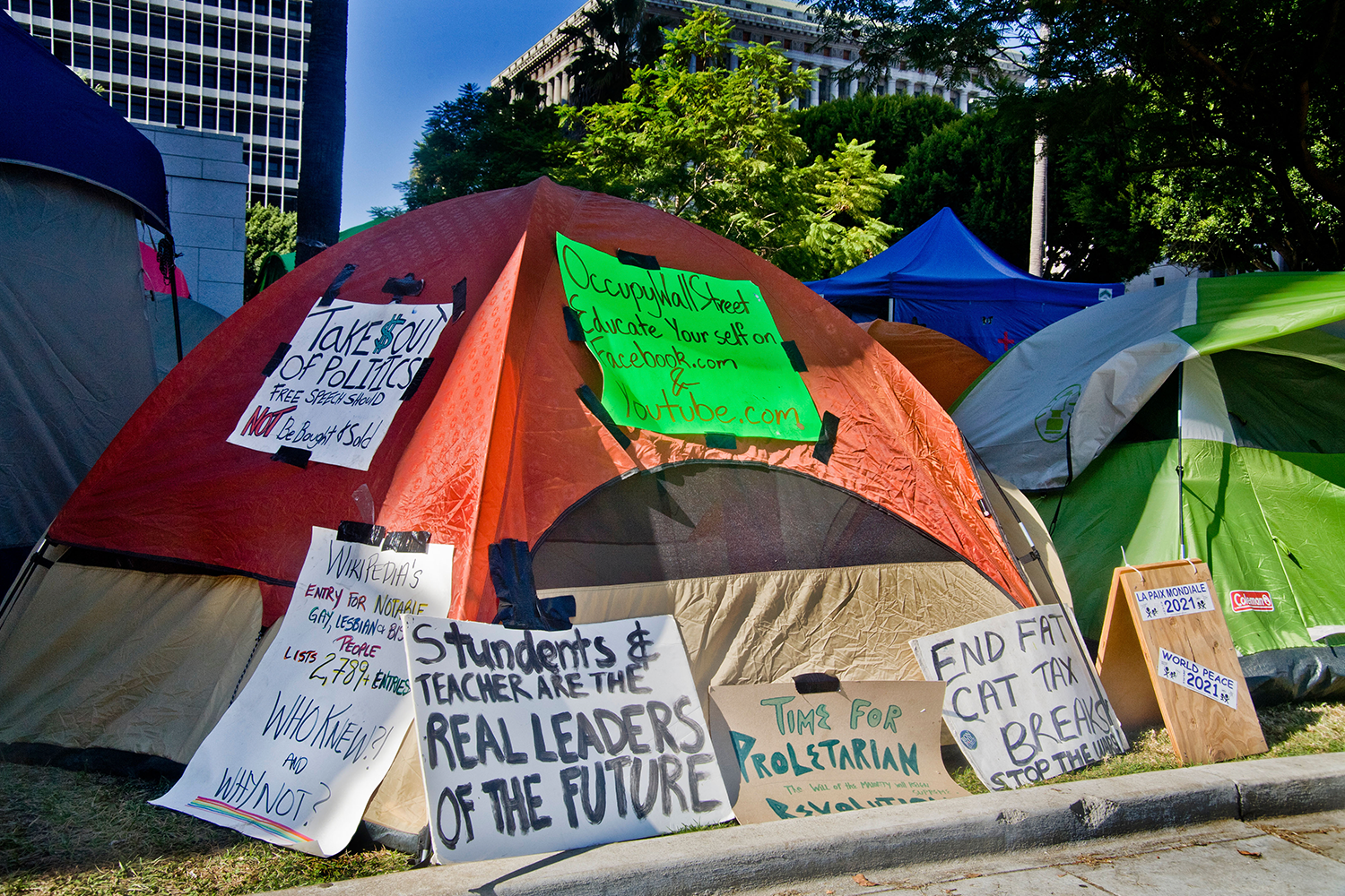 Occupy Wall St. tent covered with protest signs