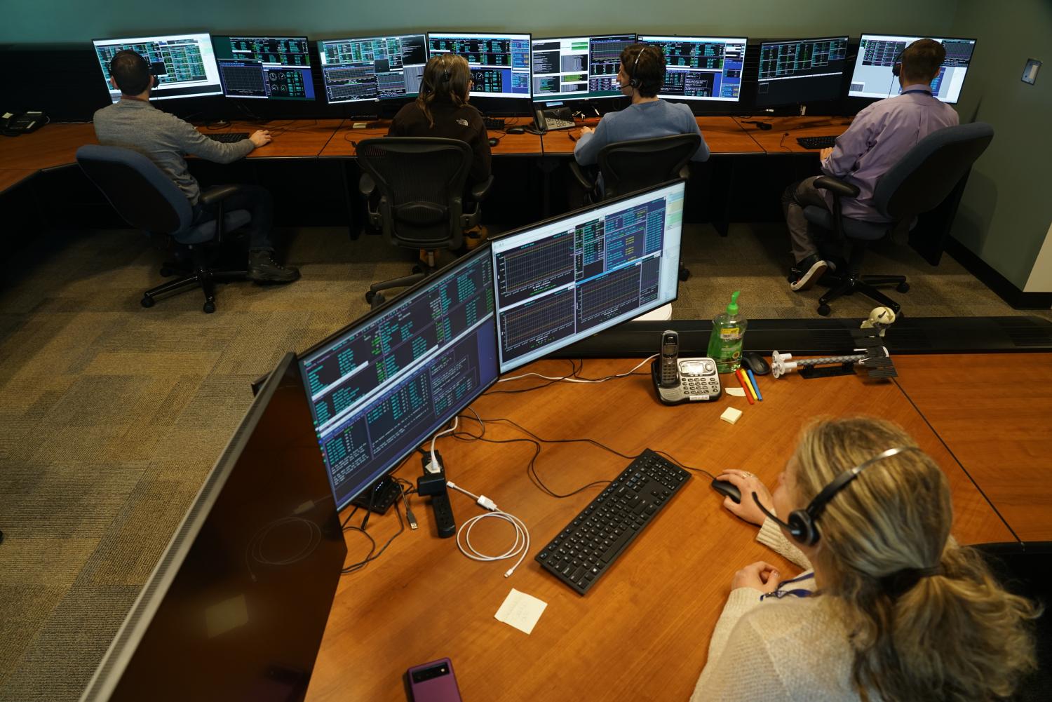 Students working at LASP's mission control