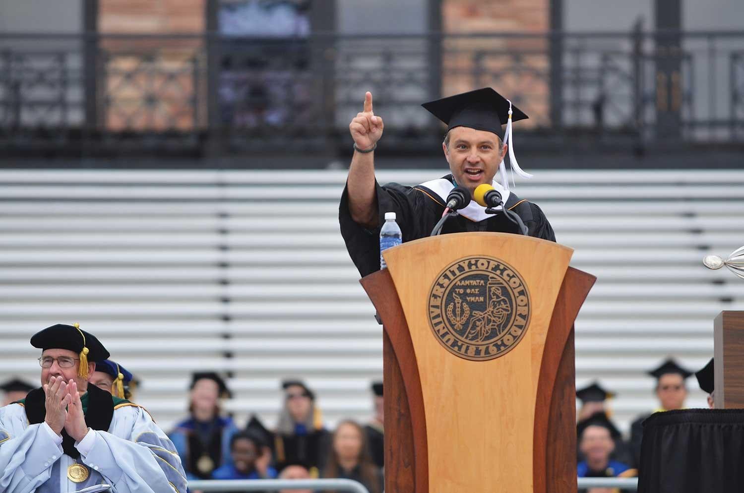 Eric Stough speaking during spring commencement