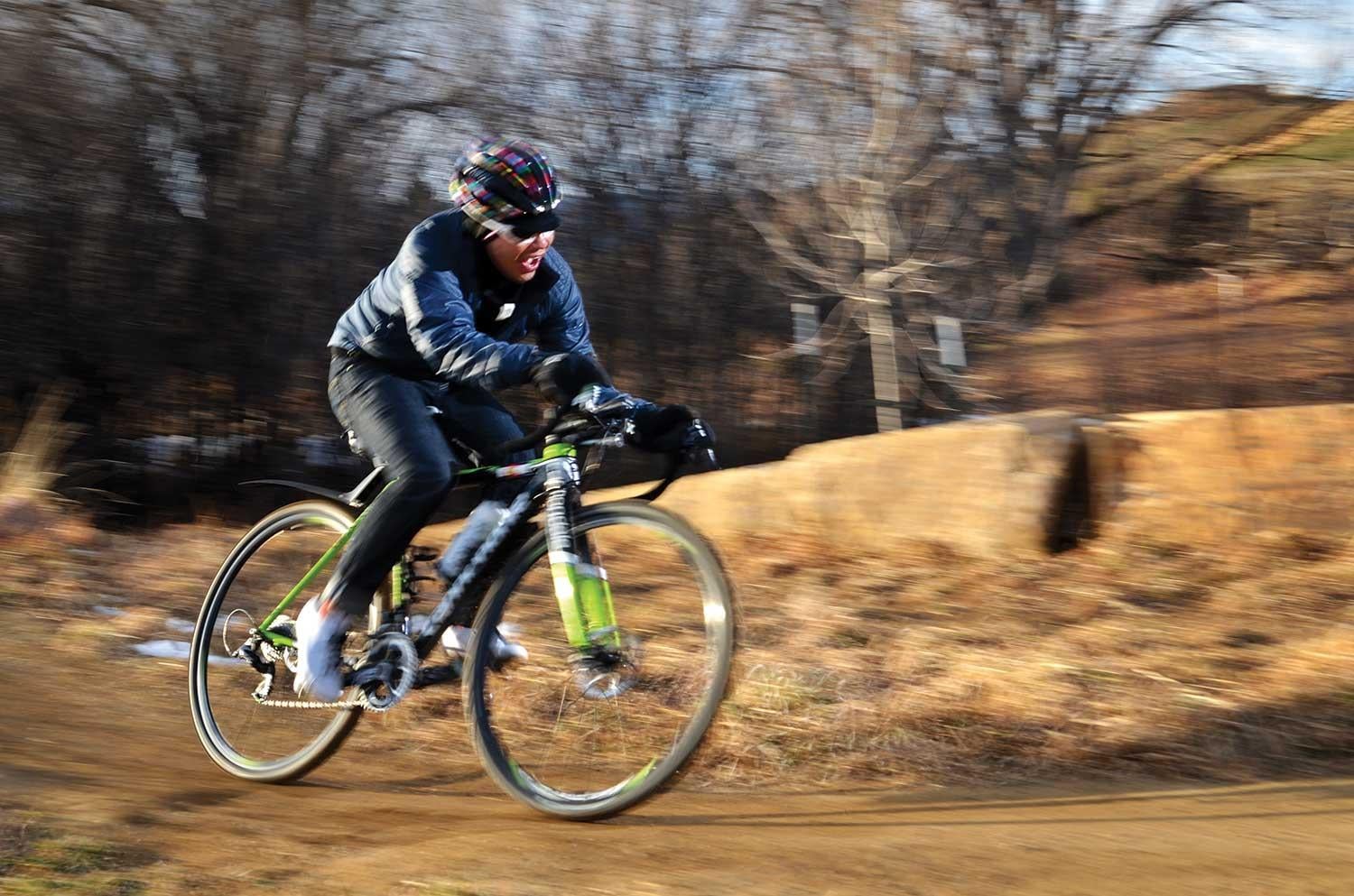 Allen Lim riding his bike on a trail