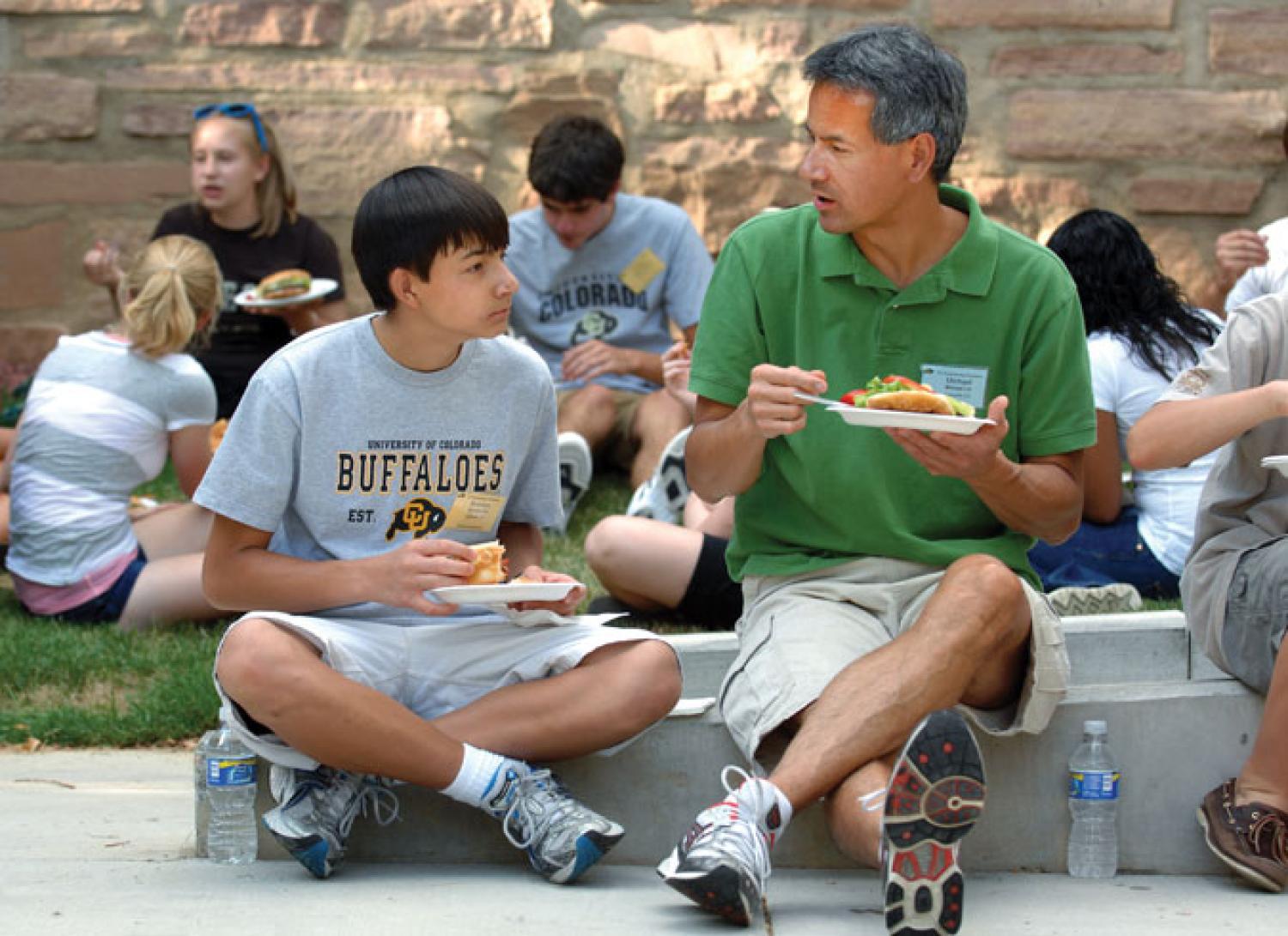 parent and student outside dorm