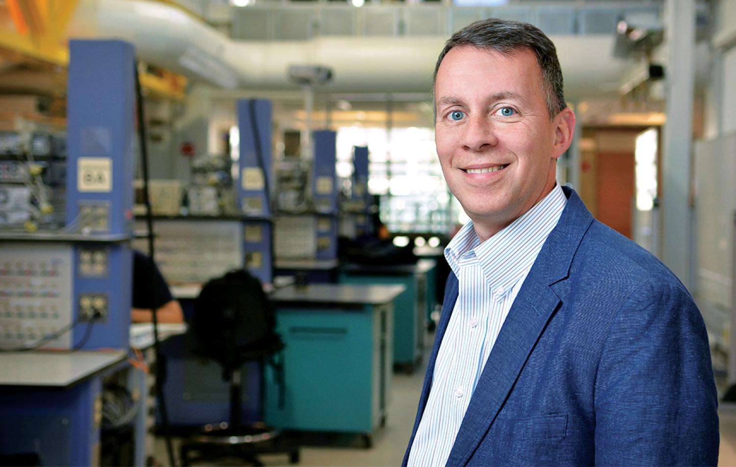 Bobby Braun poses for a photograph in his lab