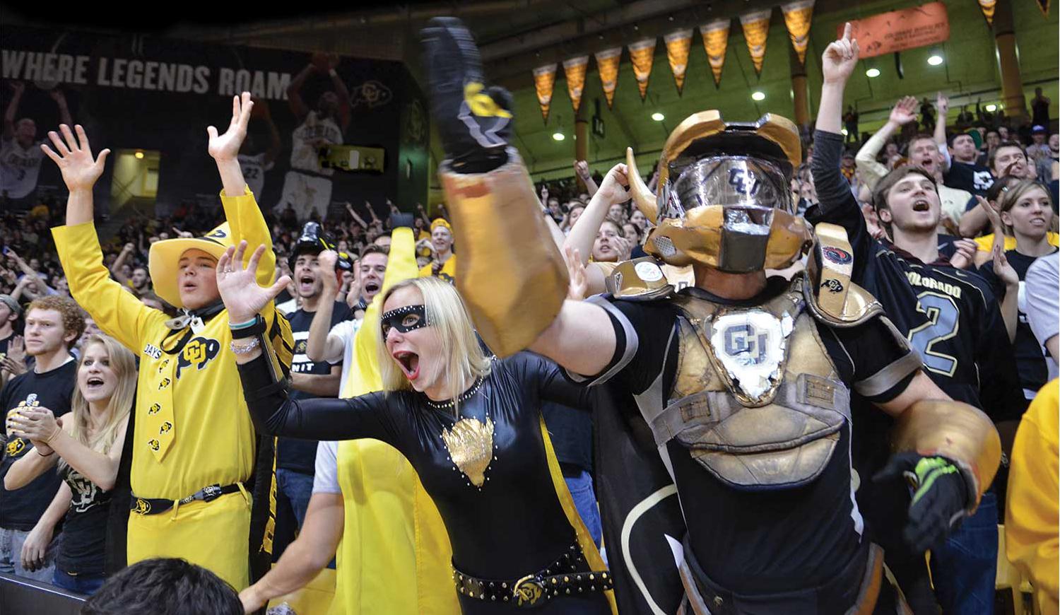 ick Shearon, known as “Buff Man,” and “Buff Girl” Courtney Benejam cheer on the Buffs