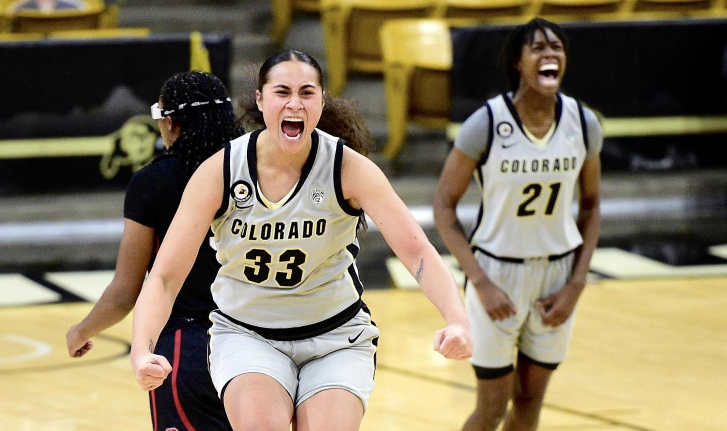 Buffs celebrate on the court after their win.
