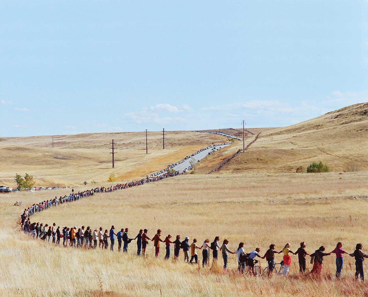 An estimated 17,000 people joined hands to encircle the plant’s 17-mile perimeter