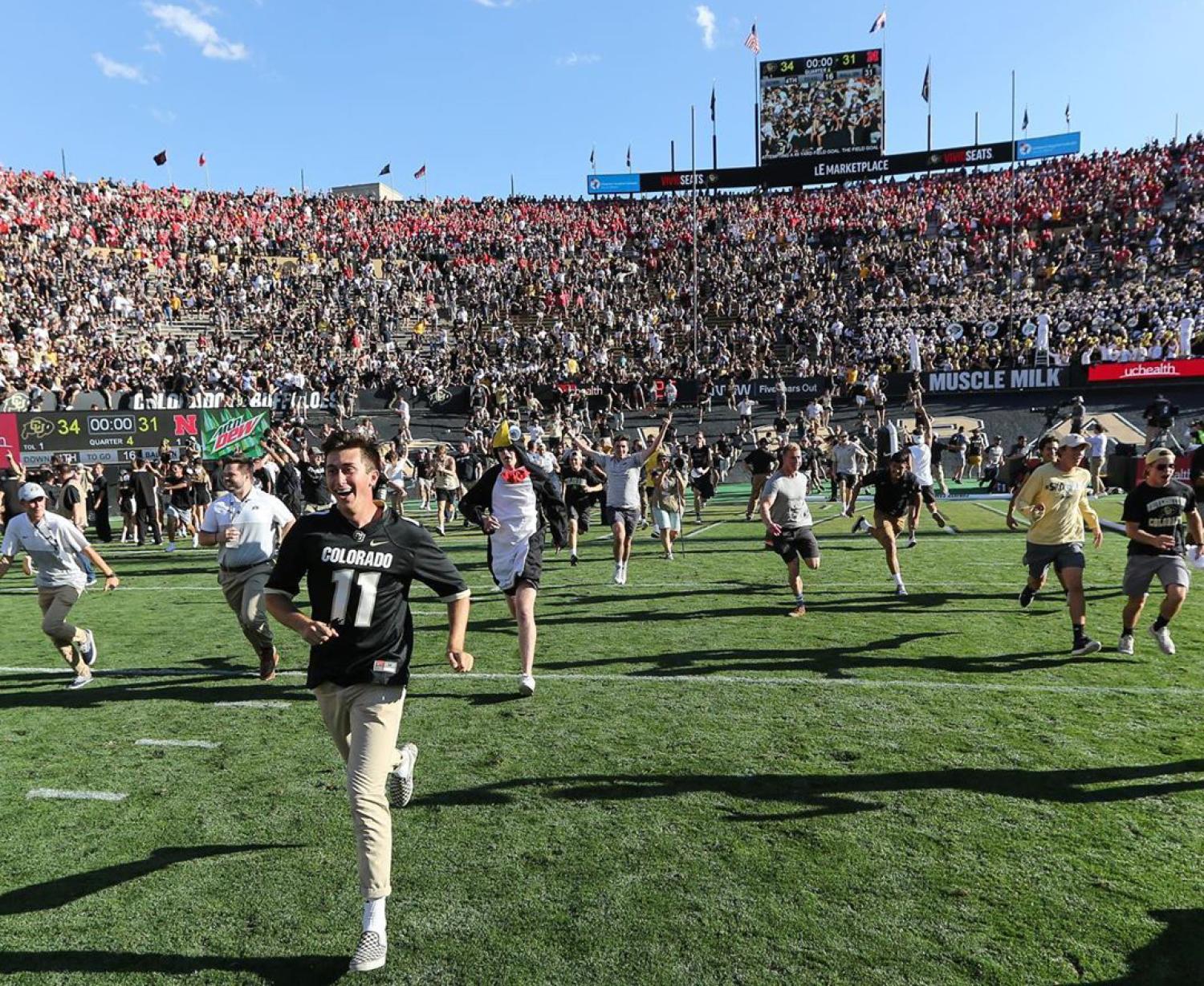 fans charging the field