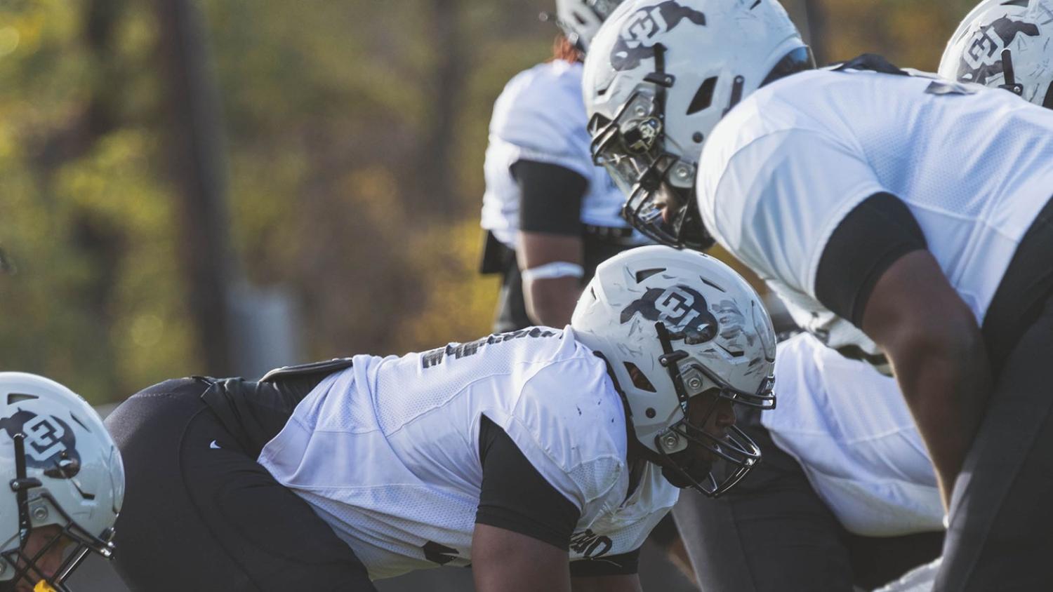 CU players scrimmage in full pads