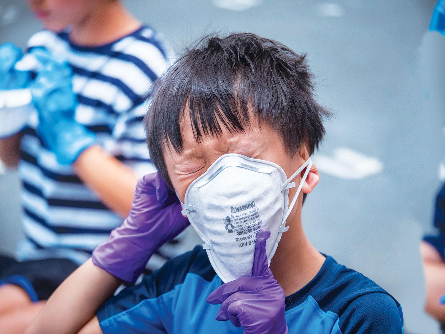 Child in a mask at CU